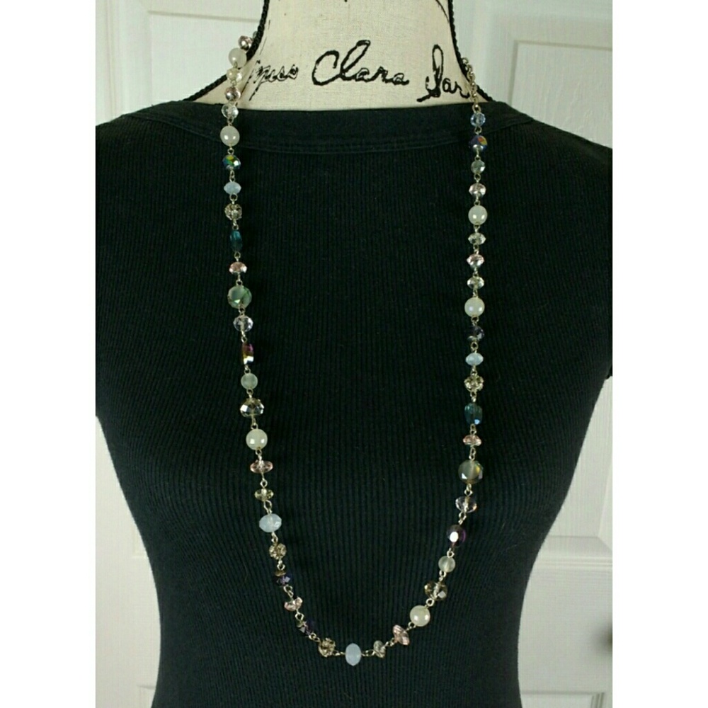 Single strand beaded necklace on silver tone chain